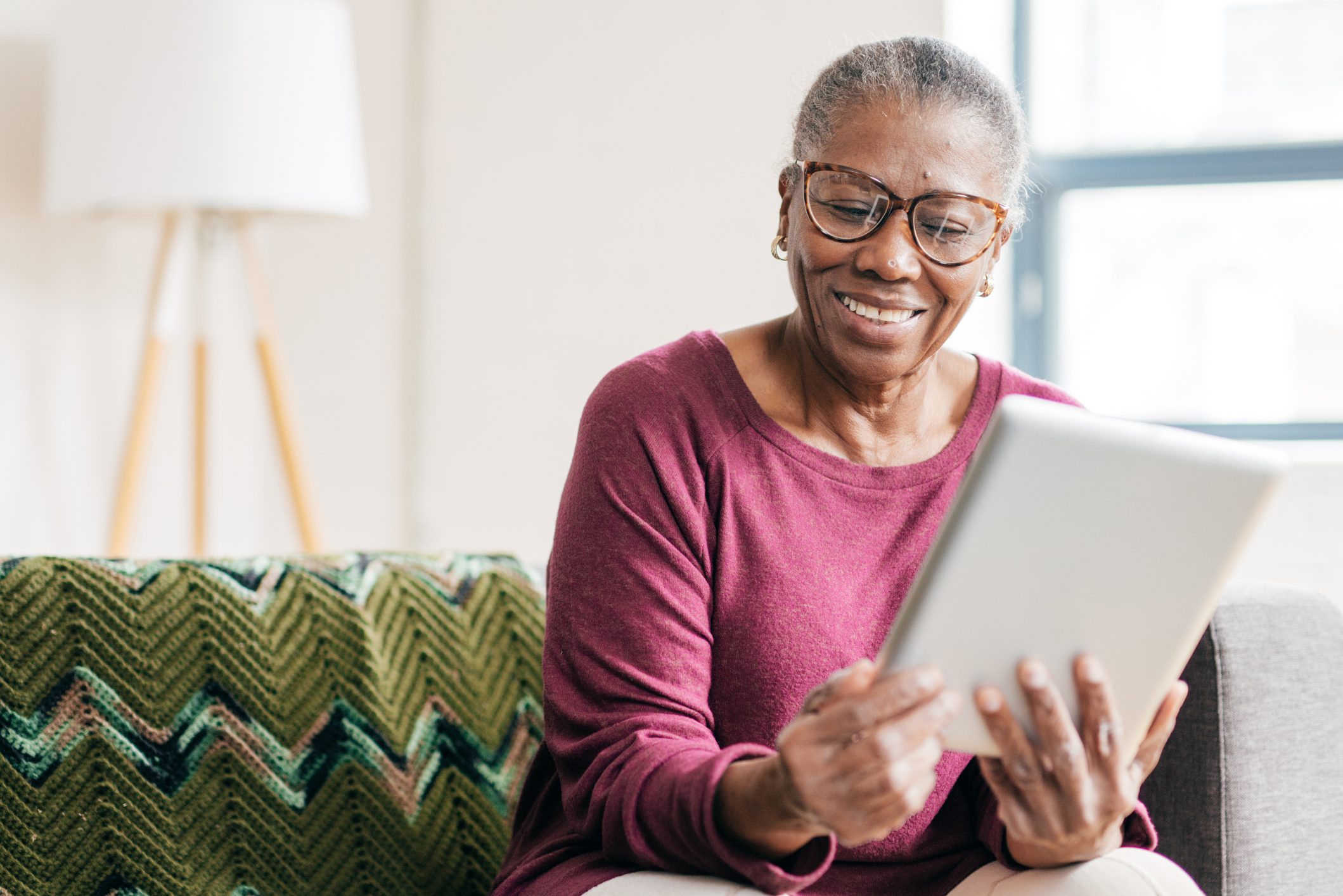 Senior women at home using tablet